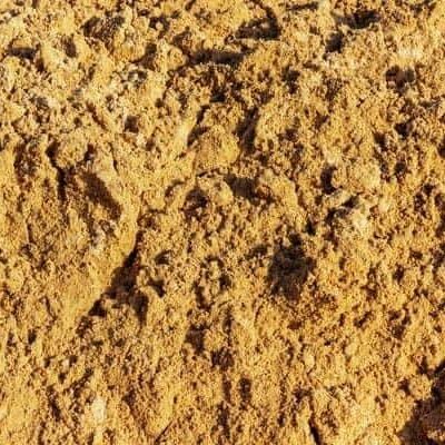 Construction sand pile texture background on a sunny day close up